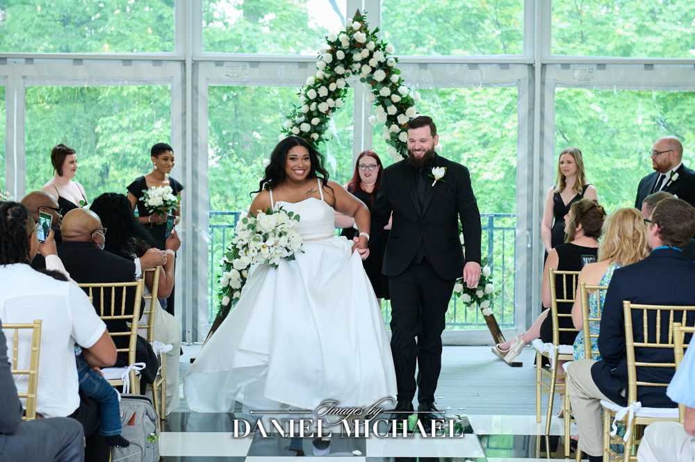 Couple walking down aisle